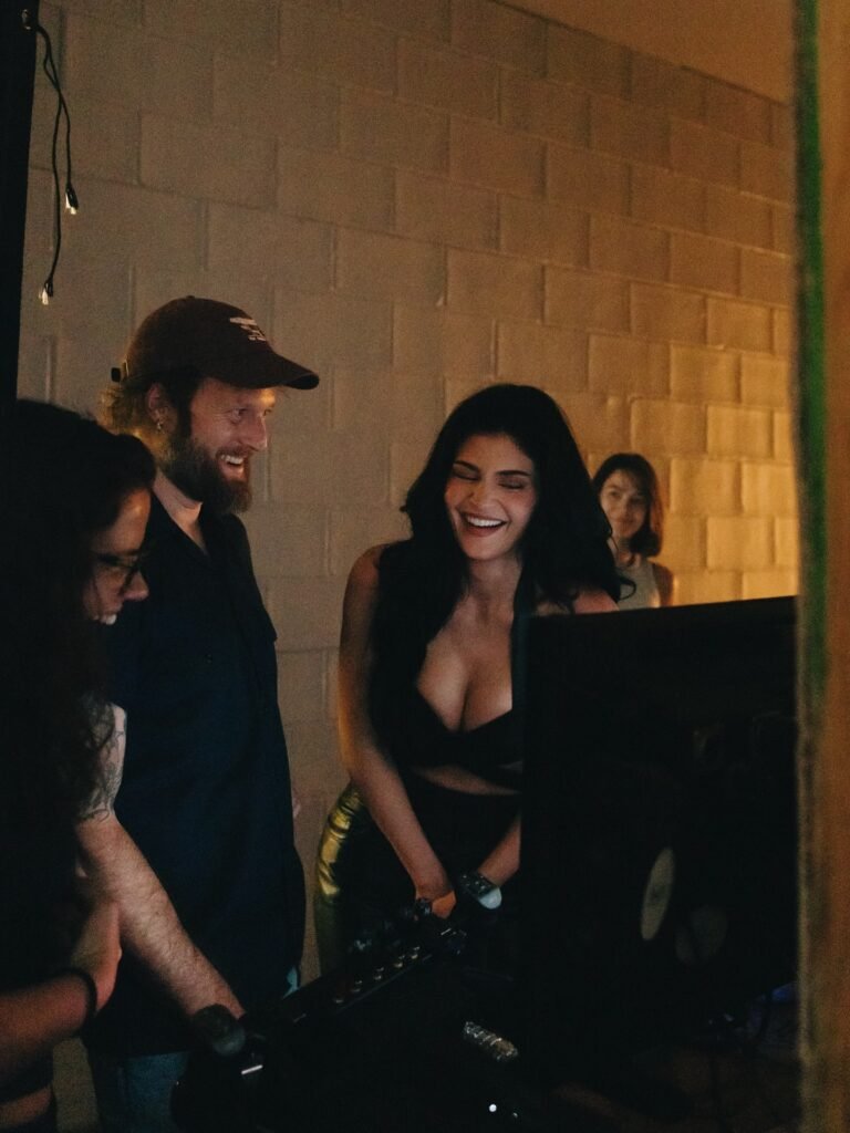 Kylie Jenner laughing with film crew during behind-the-scenes moment of Fourth Strike music video