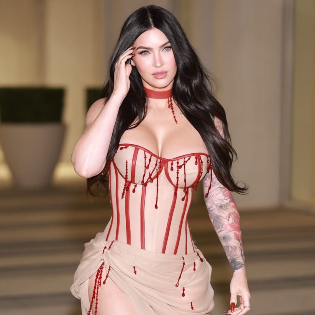 Megan Fox wearing a nude corset gown with red blood-drop crystal embellishments and matching red choker at Jennifer's Body screening