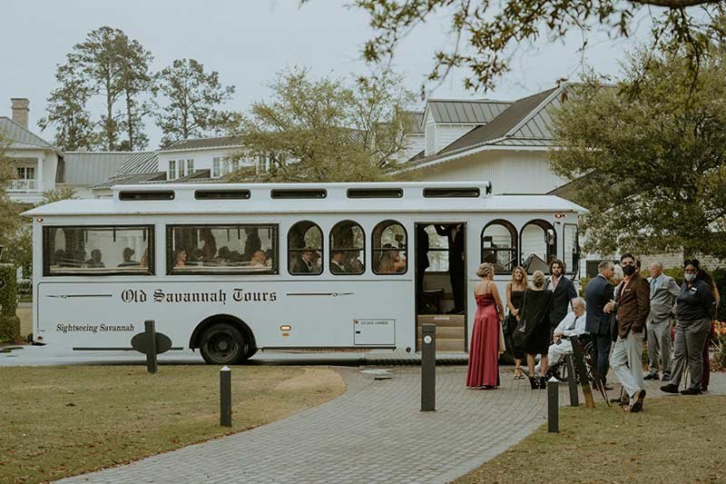 Old Savannah Tours trolley bus transporting wedding guests at Southern plantation-style reception venue
