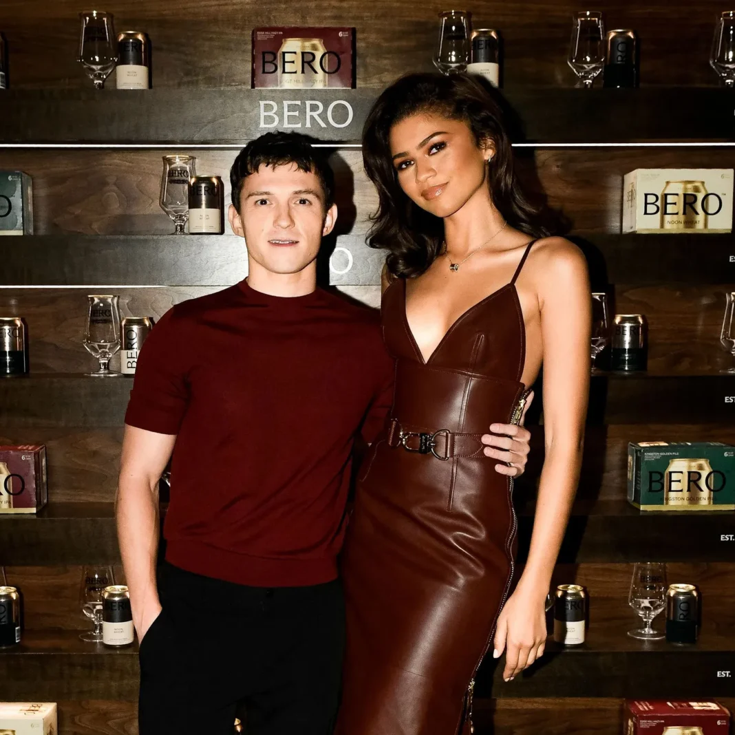 Tom Holland and Zendaya pose together at BERO event, showcasing their private relationship approach discussed in celebrity wedding privacy article