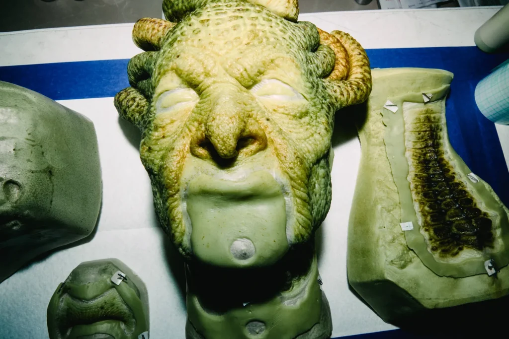 Close-up of hand painted Medusa headpiece prosthetic showing detailed reptilian scale texture and craftsmanship