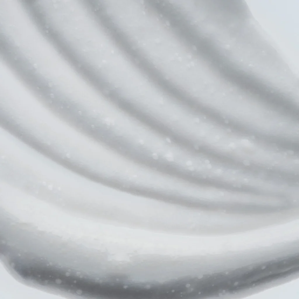 Close-up texture of DUA Skincare balancing cream cleanser showing smooth, luxurious formula consistency