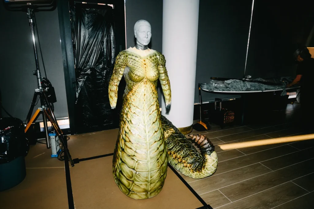 Full body view of completed Medusa costume bodysuit with hand painted scales on mannequin in production studio