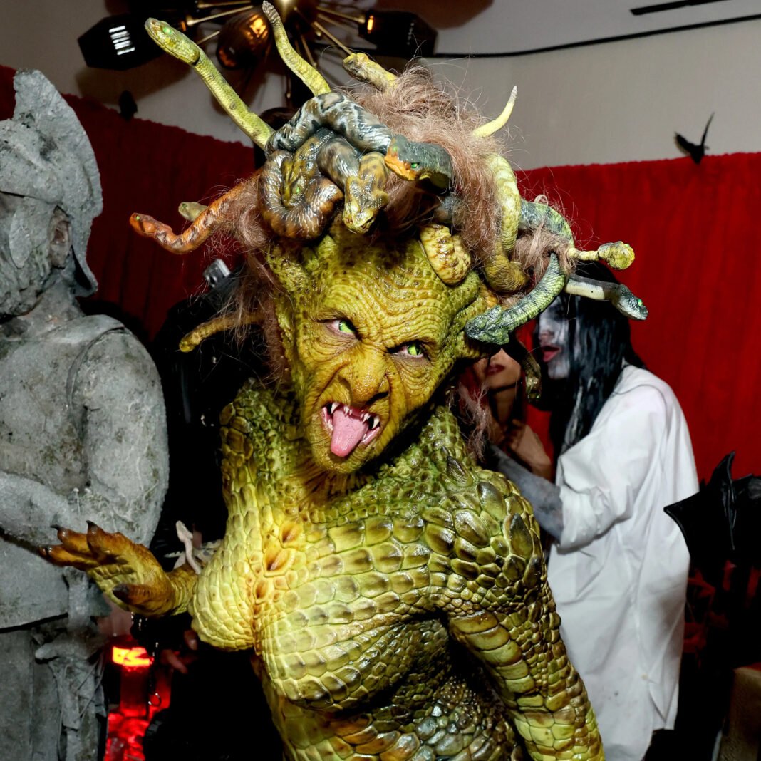 Heidi Klum in her 2024 Medusa Halloween costume featuring hand-painted scales, mechanical snakes in her hair, and prosthetic makeup at her annual Heidiween party in New York City.Retry