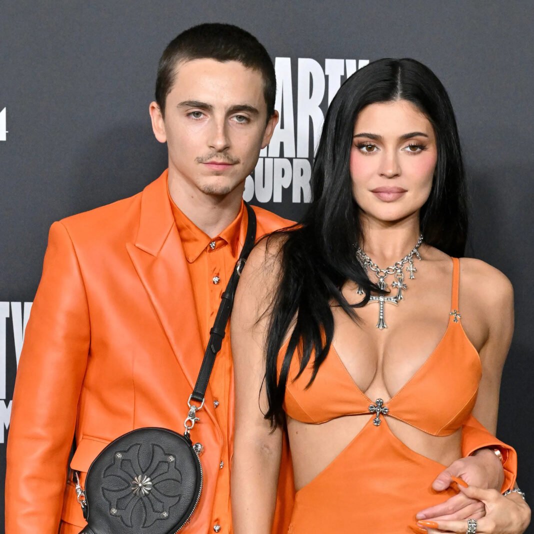 Close-up of Chalamet and Jenner at Marty Supreme premiere in custom orange looks