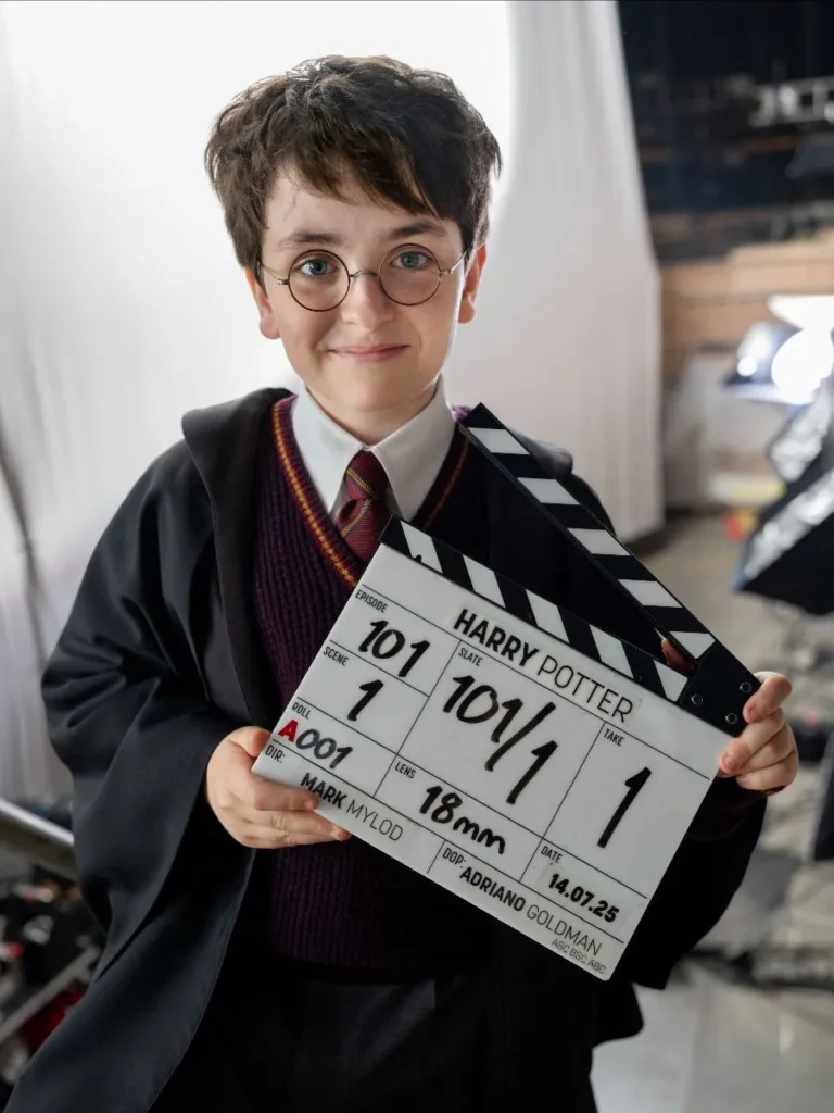 Dominic McLaughlin as Harry Potter holding the official HBO Harry Potter series clapperboard on the first day of filming, July 14, 2025, directed by Mark Mylod