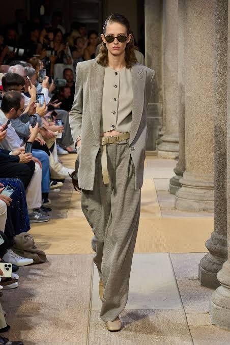 A-model-walks-the-Giorgio-Armani-Cruise-2027-runway-in-a-grey-blazer-knit-cardigan-and-belted-wide-leg-trousers