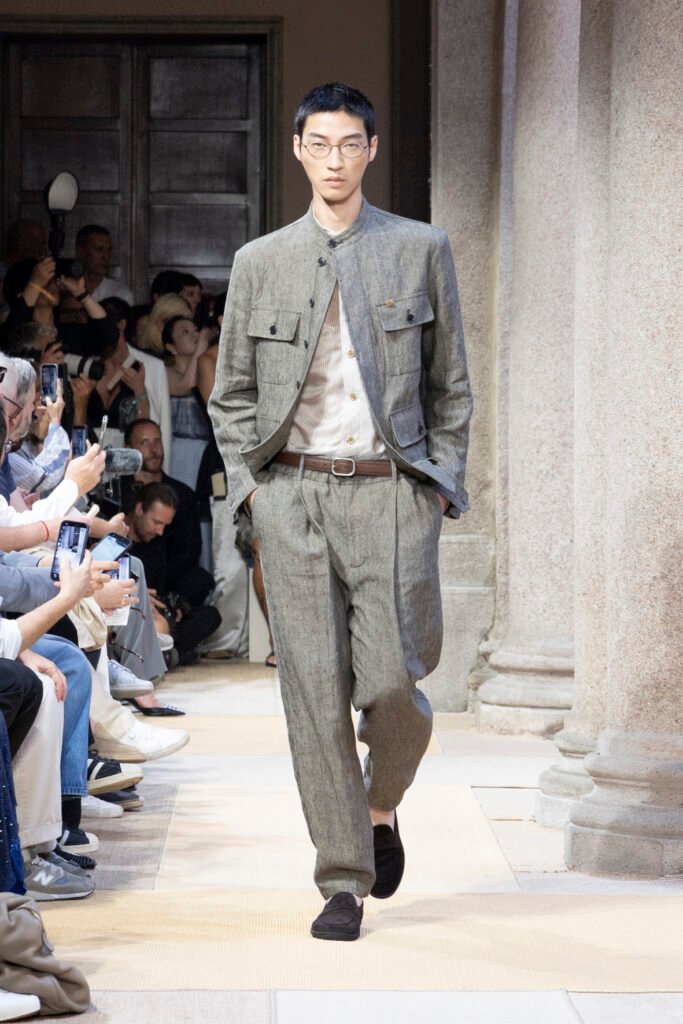 A-model-walks-the-Giorgio-Armani-SS27-menswear-runway-in-a-grey-linen-safari-jacket-and-matching-trousers