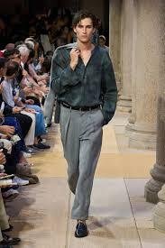 A-model-walks-the-Giorgio-Armani-SS27-menswear-runway-in-a-teal-silk-shirt-and-grey-trousers
