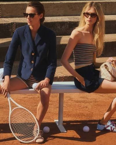 Models-in-Louis-Vuitton-Baby-Stripes-courtside-in-a-navy-blazer-with-striped-shorts-and-a-striped-bandeau-top
