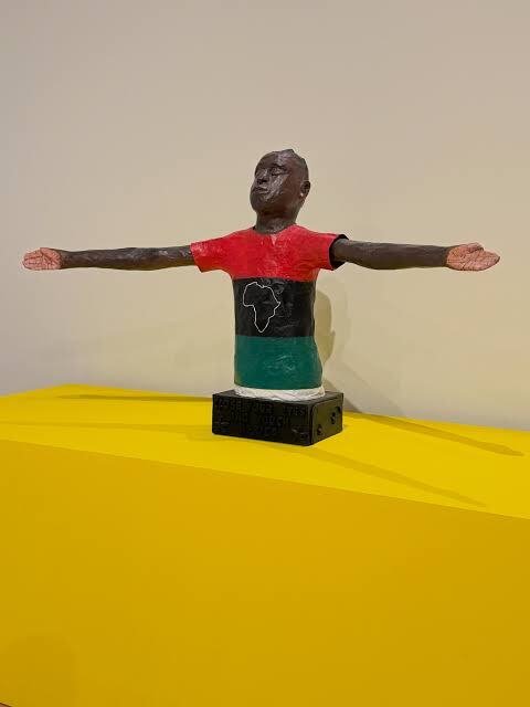 Willie-Birch-bust-of-a-man-with-arms-outstretched-in-a-Pan-African-shirt-at-CAAMs-Stories-to-Tell