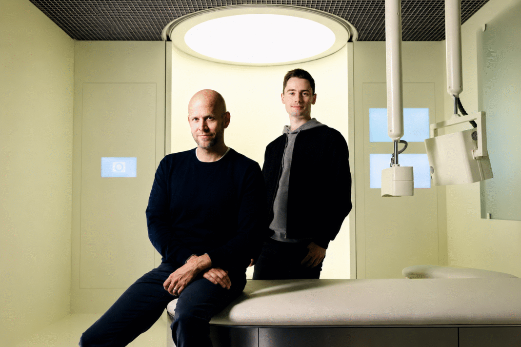 Neko Health founders Daniel Ek and Hjalmar Nilsonne beside the Neko Body Scan examination table