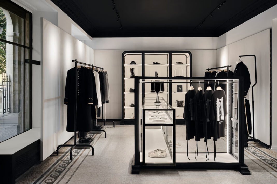 Ann-Demeulemeester-Palais-Royal-flagship-in-Paris-a-black-and-white-interior-with-garment-racks-lit-vitrines-and-mosaic-floor